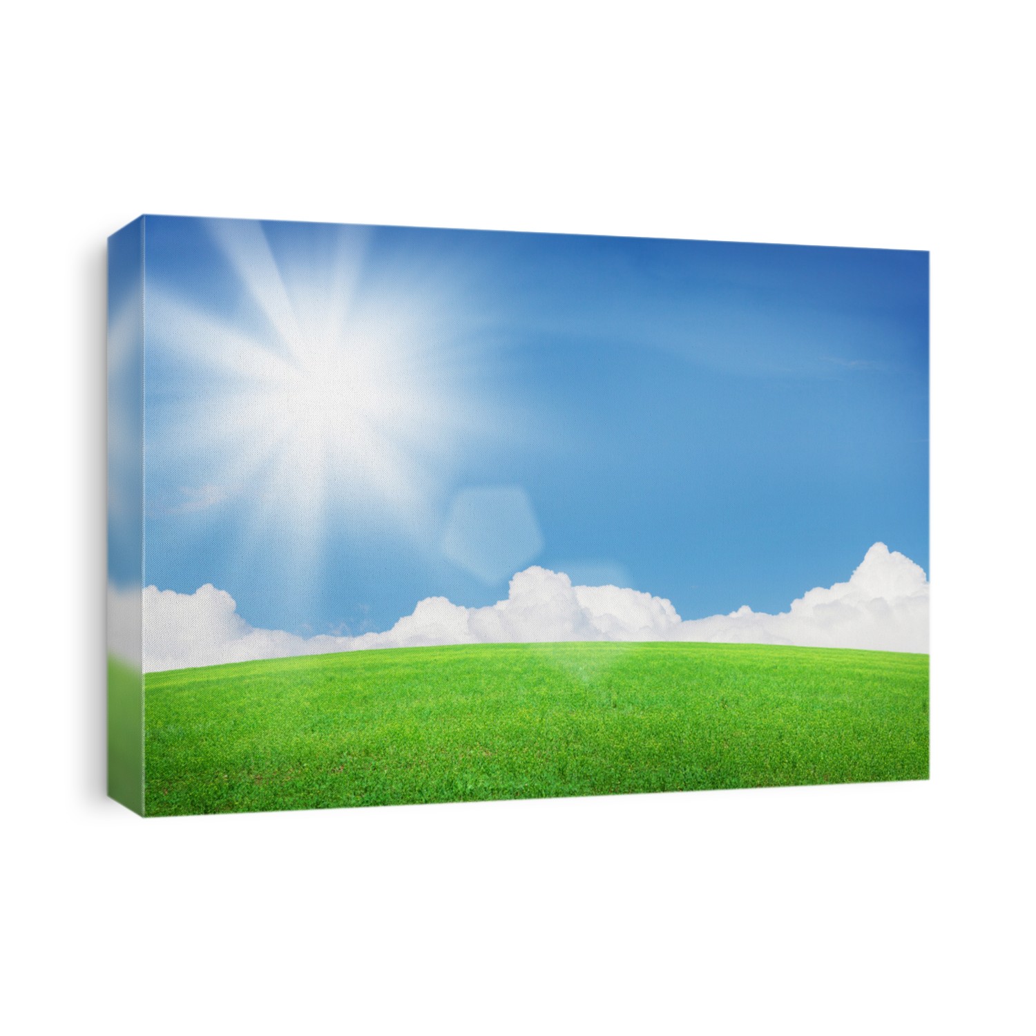 Green grass field and blue sky with clouds and bright sun. Summer landscape